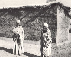 Father de Foucauld and an old disabled person.