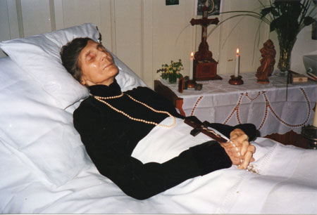 On her deathbed.